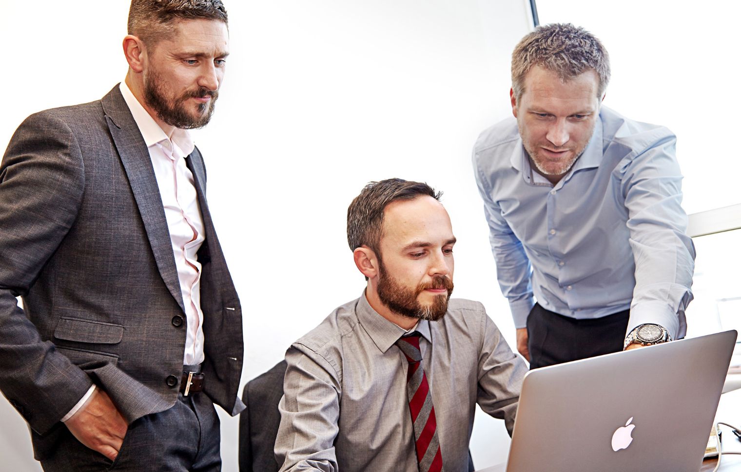 Steven Forrest, David Griffin, Ian Musgrave around lap top